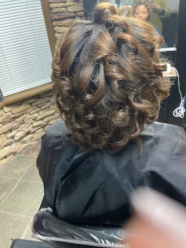Dark hair styled in defined curls